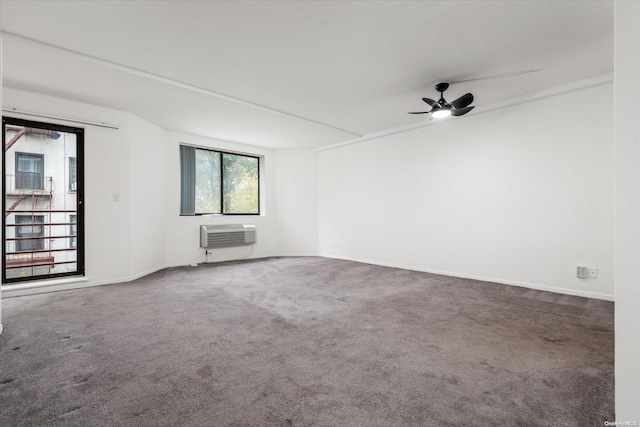 119-40 Metropolitan Ave Unit G2, Kew Gardens, NY 11415 - empty room featuring a wall mounted air conditioner, carpet, a ceiling fan, and baseboards