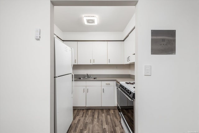 kitchen with sink, white refrigerator, black electric range, dark hardwood / wood-style floors, and white cabinetry