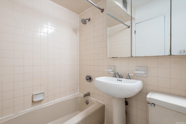 119-40 Metropolitan Ave Unit G2, Kew Gardens, NY 11415 - bathroom featuring tile walls, tub / shower combination, toilet, and tasteful backsplash