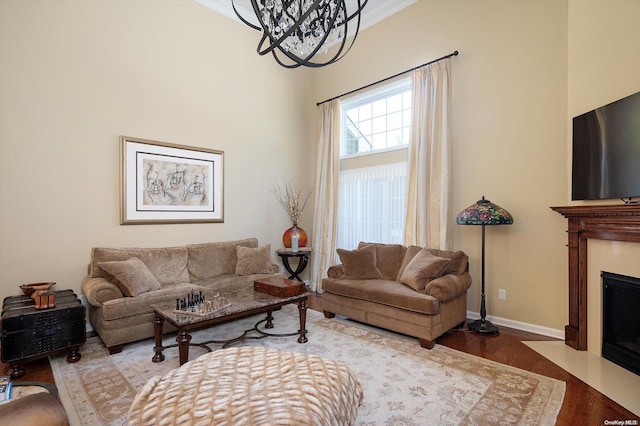 living room featuring an inviting chandelier and hardwood / wood-style flooring