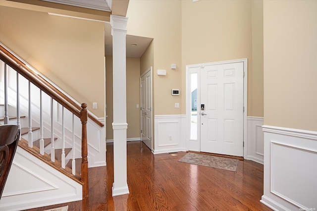 entrance foyer featuring dark wood-type flooring and a high ceiling