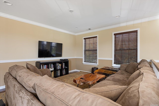 living room featuring crown molding