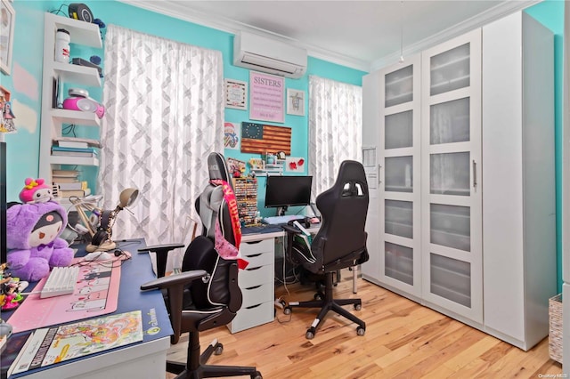 office space featuring a wall unit AC, light hardwood / wood-style flooring, and ornamental molding