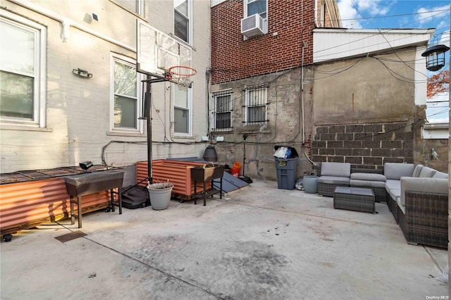 view of patio featuring an outdoor living space and cooling unit