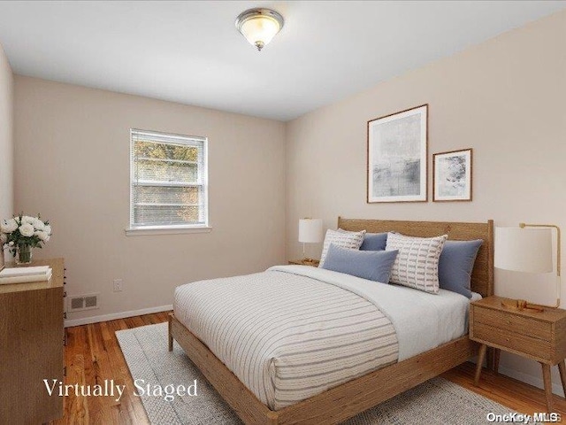 bedroom featuring wood-type flooring