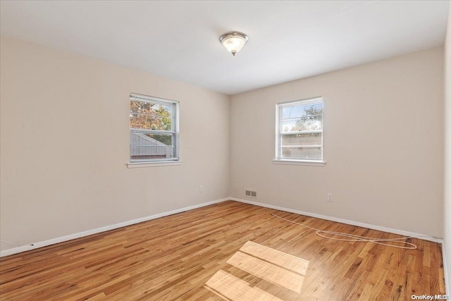 empty room featuring light hardwood / wood-style floors