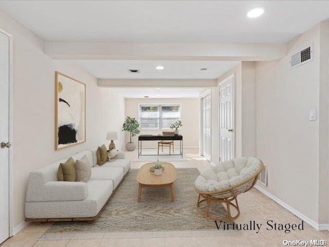 tiled living room featuring beam ceiling