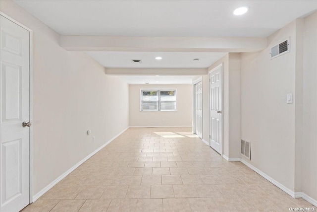 spare room with light tile patterned floors