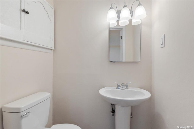 bathroom featuring sink and toilet