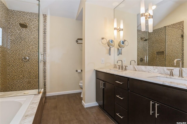 full bathroom with plus walk in shower, vanity, and toilet