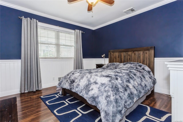 bedroom featuring ceiling fan, dark hardwood / wood-style flooring, and ornamental molding