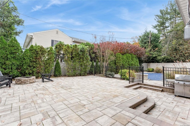 view of patio featuring a fire pit