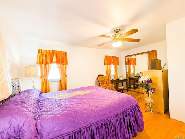 bedroom featuring light wood-type flooring and ceiling fan