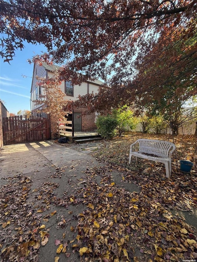 view of yard featuring a wooden deck