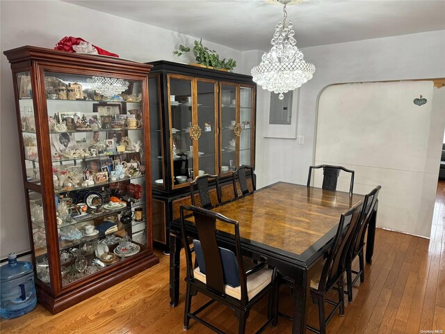 147 E 29th St, Brooklyn, NY 11226 - dining area with a chandelier, hardwood / wood-style flooring, and electric panel
