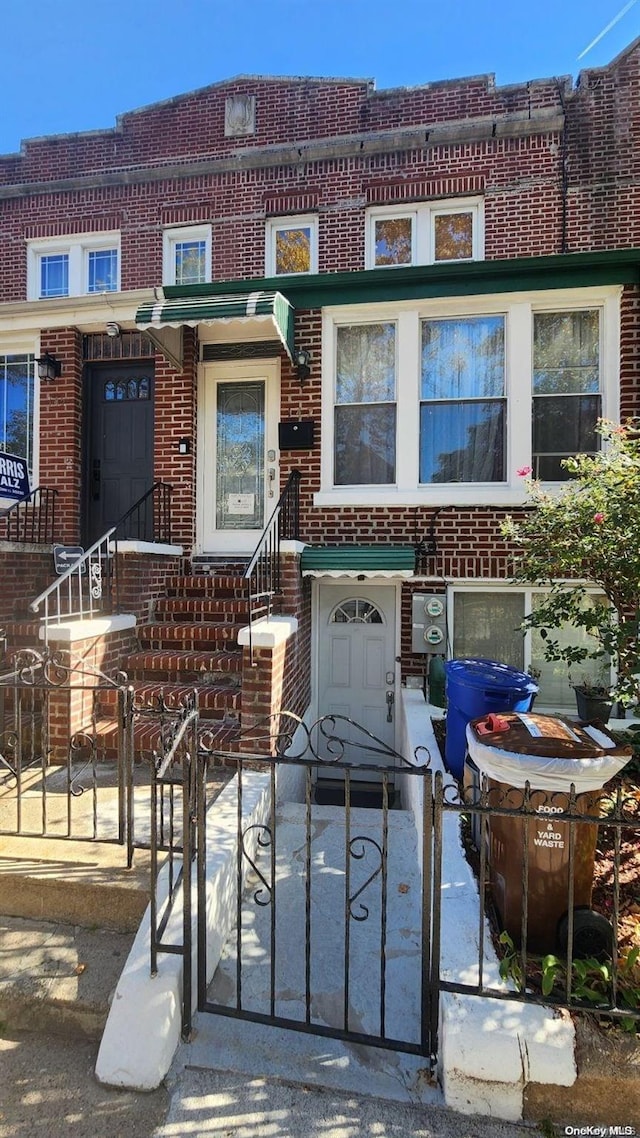 147 E 29th St, Brooklyn, NY 11226 - view of property with brick siding and a fenced front yard