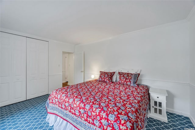 bedroom with ornamental molding and a closet