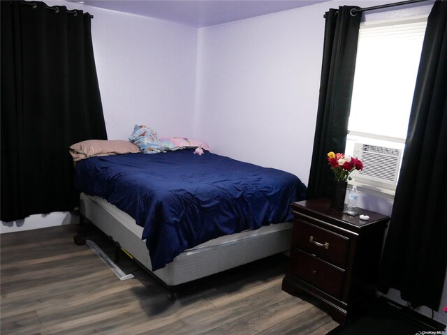 bedroom featuring wood-type flooring