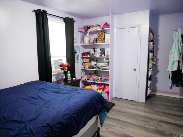 bedroom with hardwood / wood-style floors