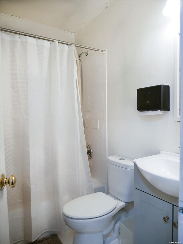 full bathroom with vanity, toilet, and shower / tub combo with curtain