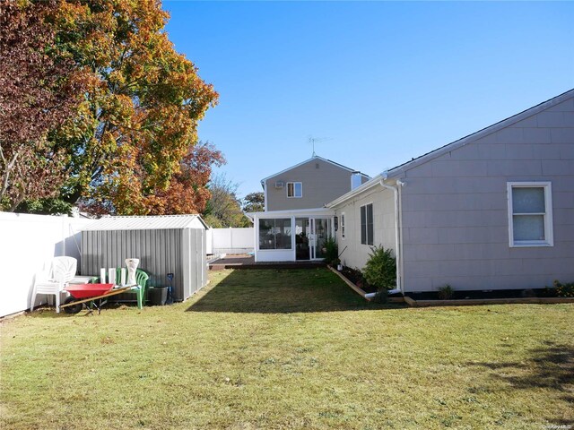 view of yard with a sunroom