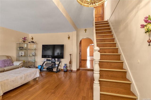 staircase featuring wood-type flooring