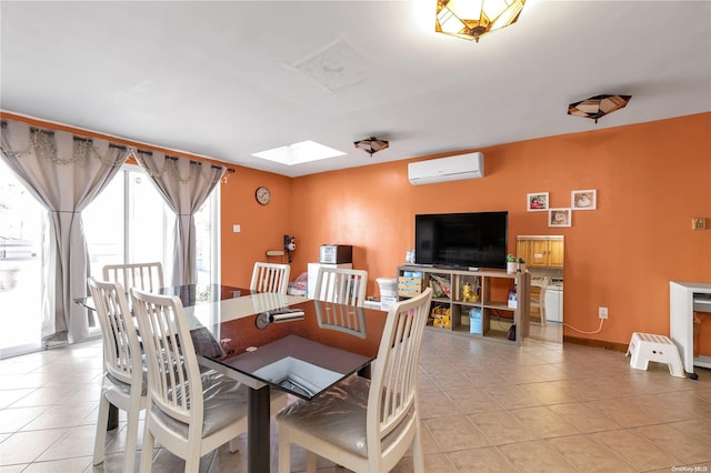 dining space with a skylight, light tile patterned flooring, and a wall mounted air conditioner