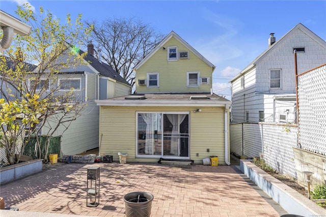 rear view of property featuring a patio