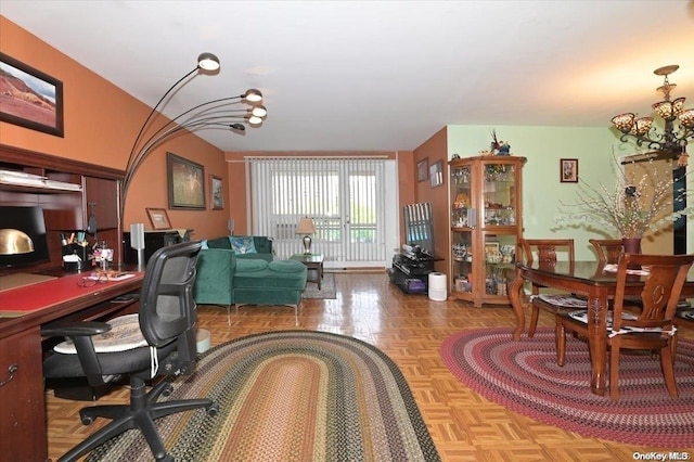 office area featuring a chandelier and parquet flooring