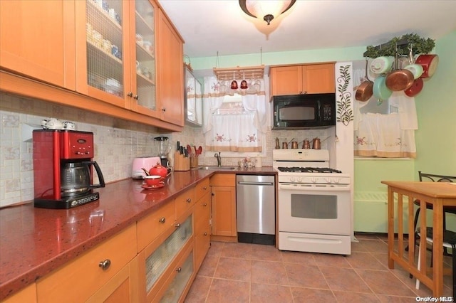 kitchen featuring white range with gas stovetop, light tile patterned floors, tasteful backsplash, and dishwasher