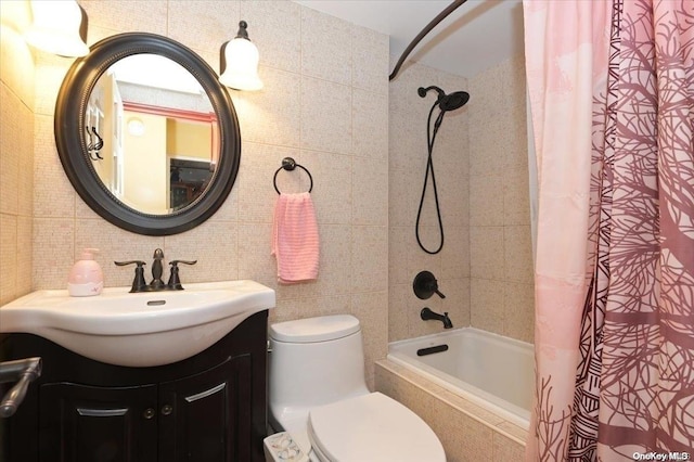 full bathroom featuring tile walls, vanity, shower / bath combo, and toilet