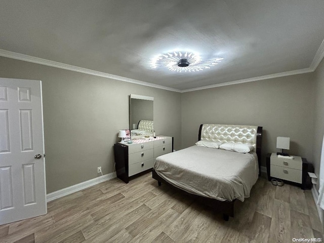 bedroom with light hardwood / wood-style floors and ornamental molding