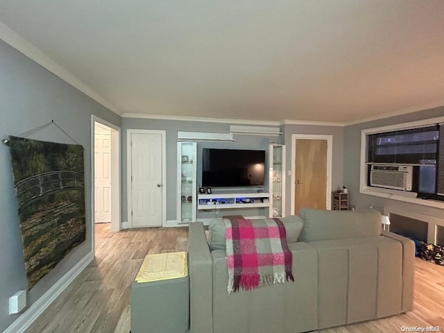 living room featuring crown molding, light hardwood / wood-style flooring, and cooling unit