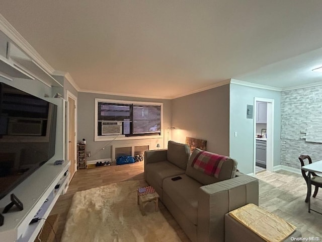 living room with cooling unit, light wood-type flooring, and crown molding