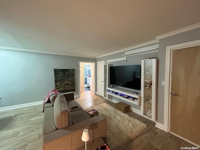 living room with light wood-type flooring and crown molding