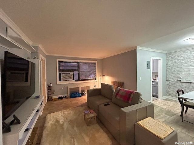 living room with cooling unit, crown molding, and light hardwood / wood-style flooring