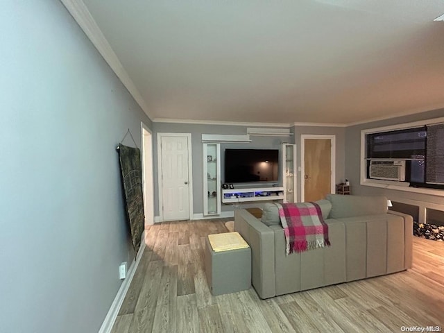 living room featuring crown molding, cooling unit, and light hardwood / wood-style floors