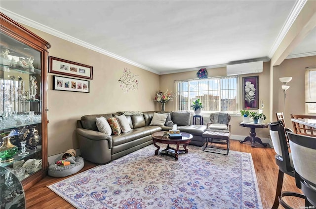 living room featuring hardwood / wood-style flooring, ornamental molding, and a wall mounted AC