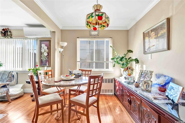 dining space with a wall mounted air conditioner, light hardwood / wood-style flooring, radiator, and ornamental molding