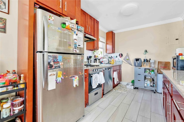 kitchen featuring stainless steel appliances, light stone counters, crown molding, and water heater