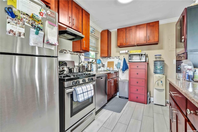 kitchen with light stone countertops, appliances with stainless steel finishes, decorative backsplash, and ornamental molding