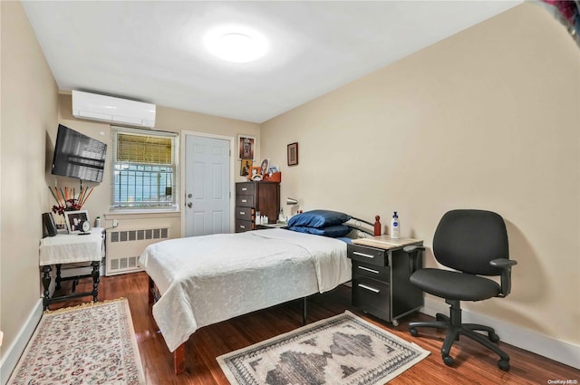 bedroom featuring radiator heating unit, dark wood-type flooring, and a wall mounted AC