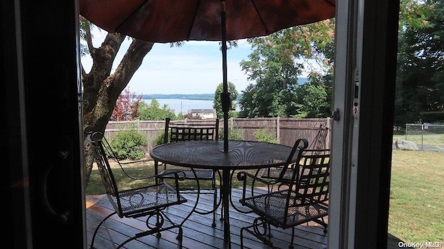 wooden deck featuring a water view