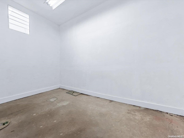 spare room with concrete flooring