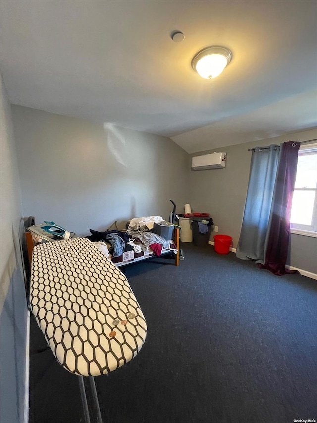 bedroom featuring a wall mounted AC, carpet, and vaulted ceiling