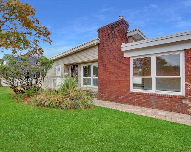 view of home's exterior featuring a lawn