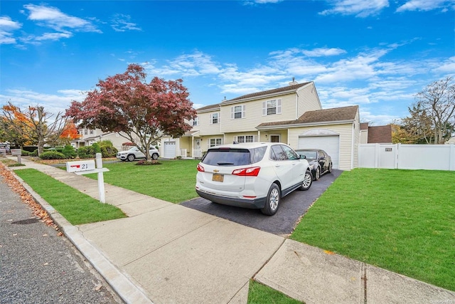 view of front facade featuring a front lawn and a garage