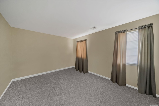 spare room featuring carpet flooring