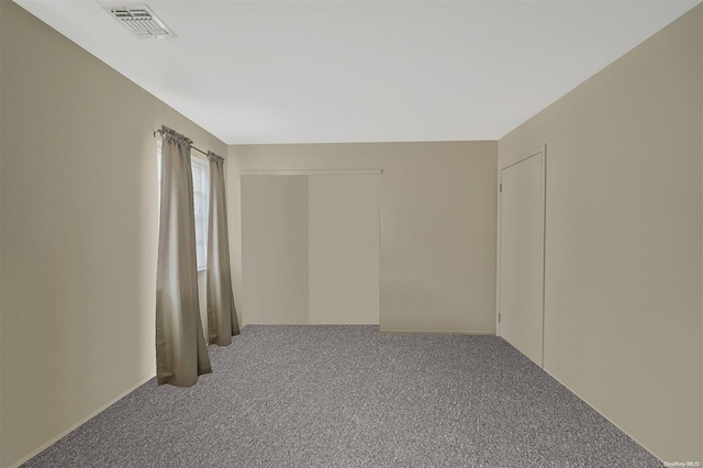 empty room featuring carpet floors