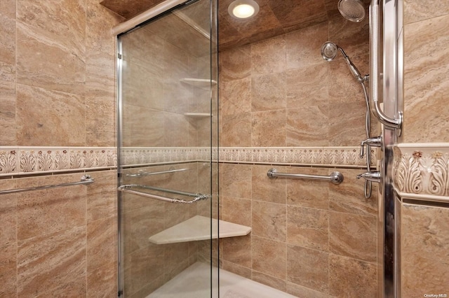 bathroom with a shower with shower door